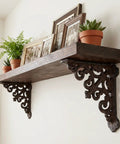 Built Like A Tank 4 Pack Solid Cast Iron Shelf Brackets 4x4 Inch Heavy Duty Corner Supports For Floating Shelves vintage brown bracket with wooden shelf and plants.