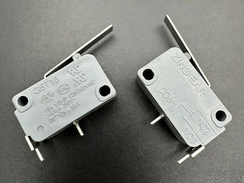 Two G5T16 Normally Open Micro Switches with Lever, 2 Pin, 16A 125 to 250V AC, gray heavy duty limit switches on black surface