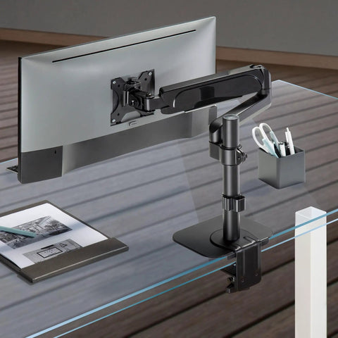 Built Tough Steel Monitor Mount Reinforcement Plate Keeps Glass And Thin Desks Safe From Cracks with monitor arm on a glass desk.