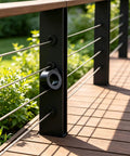 20 Pack 3/8 Inch Black Cable Railing Angle Washers T316 Marine Grade Stainless Steel Rock Solid 30 Degree Beveled Brackets Pro Team Gear For Sloped Stairs And Rugged Deck Installations Top Shelf Alignment Slick Finish installed on a deck railing with greenery.