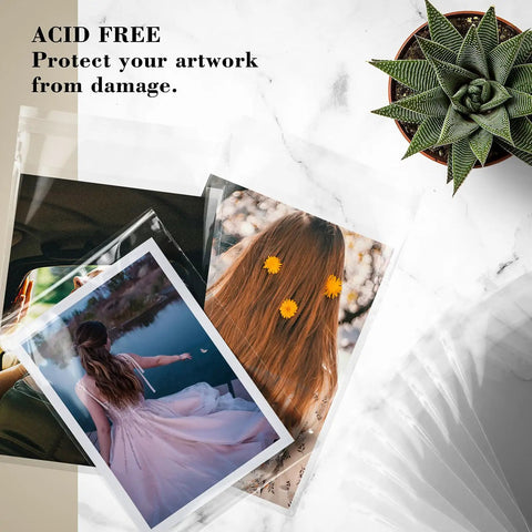 Crystal Clear 11x14 Self Sealing Sleeves Pack Of 100, 1.6 Mil Acid Free Resealable Bags for Photos and Prints on marble surface