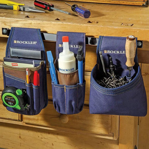 Heavy Duty Carpenter Tool Pouch With Belt Clip For Easy Access To Tape Measure Pencils Square And More Clip On Utility Bag For Woodworking Pros And DIYers, showing hanging on wooden bench with multiple tools