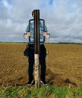 Person using 34Lb T Post Driver With Handles Pro Grade Heavy Duty Metal Fence Post Driver And Hole Digger For Wood Posts