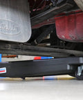 17 Gallon Low Profile Truck Drain With 120V Electric Pump positioned under truck for easy fluid cleanup with 6ft discharge hose.
