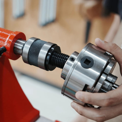 BMWOOD woodturning live tailstock chuck adapter on lathe; silver metal body with knurled black grip, #2 Morse taper, 1" x 8TPI thread