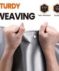 Hands gripping Heavy Duty Tarp 10x12 Ft 12 Mil Waterproof With Grommets Tough As Nails All Weather Shield UV Resistant And Tear Proof