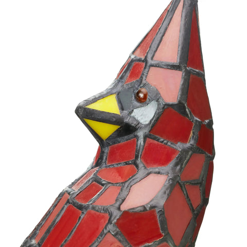 Close-up of red stained glass bird lamp with Tiffany style vibe, detail of bird's head and patterns.