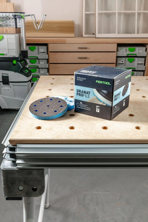 Granat Profile Soft 5 Inch 125 mm Sanding Discs 10 Pack with Flexible Foam Backing on workbench, box and disc visible