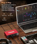 All In One USB Audio Interface For Recording, Podcasting And Streaming, 24 Bit 192 KHz, beside laptop and keyboard on desk