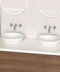 Premium Oval Ceramic Vessel Sink For Bathroom Vanity Countertop Glossy White Porcelain Bowl Above Counter displayed on modern vanity.