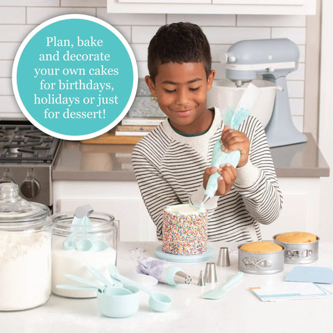 Child using Playful Chef Kids Cake Decorating Kit With Pans Reusable Pastry Bags Stencils And Recipes For Real Baking Fun.