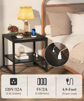 Black end table with charging station for living room, 2 AC outlets, 3 USB ports, 59-inch power cord, lamp and flowers on top