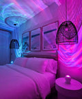 Bedroom with LED Aurora Projector casting Northern Lights Vibe, showcasing Chill Bedroom Relaxation Mood Lighting on walls and ceiling.