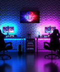 Gaming setup with colorful LED lighting, featuring 33 Pack 3D Diamond Wall Panels for Interior Decor, PVC Flower Texture, on the wall.