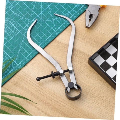 The Real Deal Heavy Duty Outside Caliper For Woodturning Precision Measuring Tool Built Tough Using Premium Carbon Steel Truly Portable Woodworking Accessory With Knockout Accuracy Guaranteed on a wooden table.