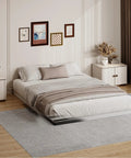 King Size 2 Inch Low Profile Box Spring Heavy Duty Bunkie Board Mattress Foundation With Fabric Cover in modern bedroom setting.