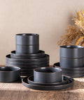 Top Tier Real Deal 12 Piece Stoneware Dinnerware Set With Sleek Matte Finish Includes Four Dinner Plates Salad Dishes And Cereal Bowls Lead Free stacked on a wooden table.