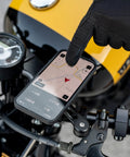 Anti Vibration Module SPC Plus Accessory For Smartphones, mounted on motorcycle handlebar with navigation display, includes M5 screws