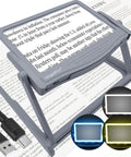 Rechargeable 5X LED Page Magnifier With Foldable Stand Eye Care Anti Glare Lens 24 LED Lights 3 Color Light Modes shown on text