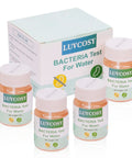 4 Pack Coliform E Coli Water Test Kit Works Like A Charm For Fast 48 Hour Home Well Tap Pool And Lake Testing Easy No Hassle Bacteria Detector For Safe Drinking Water That Keeps Your Family Happy And Totally Worry Free Any Day with four test vials and packaging.