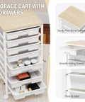Rolling Cart With Eight Drawers Wooden Tabletop Storage Cart On Lockable Wheels For Craft Room Office Living Room Classroom And Bedroom Great For Organizing Supplies With Easy Mobility And Durable Build, showing organized white drawers and wooden top.