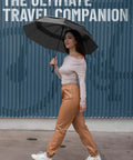 Woman using Windproof Travel Umbrella Auto Folding With 85 MPH Wind Resistance Beastly Compact Rain And Sun Shield