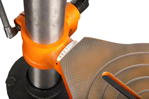 Close-up of a cast iron worktable and sliding head of Six Point Two Amp Thirty Three Inch Radial Arm Drill Press for benchtop use.