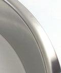 Close-up of polished stainless steel trash grommet for countertops fits in a 12 inch hole with 12.75 inch width and 2 inch depth.