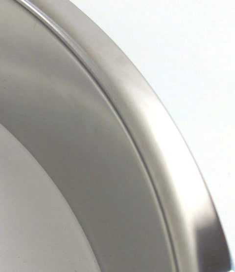 Close-up of polished stainless steel trash grommet for countertops fits in a 12 inch hole with 12.75 inch width and 2 inch depth.