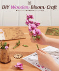 3D Wooden Flower Puzzle Kit For Adults, Dope DIY Botanical Orchid Build Set, Purple Moth Orchid Craft Project, Perfect Gift For Mother's Day, Valentine's Day, Teacher's Day, Home Decor And Creative Relaxation. Hand assembling purple wooden orchid parts on table