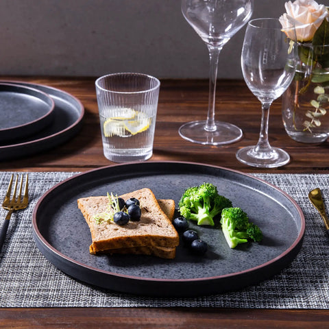 Top Tier Real Deal 12 Piece Stoneware Dinnerware Set With Sleek Matte Finish Includes Four Dinner Plates Salad Dishes And Cereal Bowls Lead Free Game Changer Kitchen Essentials on a table