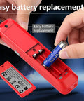 Red handheld freon leak detector, angled view with open battery slot as AA battery is inserted