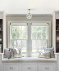 Dope Mid Century Modern Globe Semi Flush Mount Ceiling Light With Clear Glass And Gold Brass Finish in cozy nook space