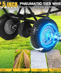 12.5-inch pneumatic wheel on heavy duty tow behind fertilizer and seed spreader with 130 lb hopper for all-terrain use.