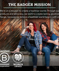 Two women sitting on a wooden stoop, showcasing sustainability and women-owned business certification logos