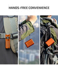 Hands-free use of Baton4 Rechargeable EDC Flashlight with 1300 Lumens, bright orange, clipped to backpack and held by person.