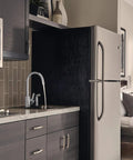 Precept Single-Handle Kitchen Faucet With Side Sprayer In Chrome, 360 Degree Swivel, visible in modern kitchen setup