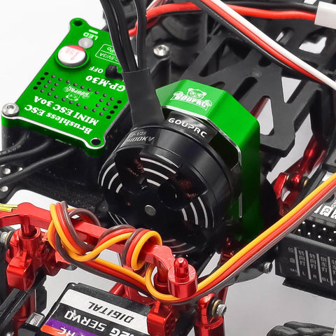 Close-up of 2204 2400KV Brushless Outrunner Motor with transmission and 30A Mini ESC installed in SCX24 remote crawler kit