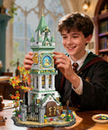 Epic Clock Tower Building Set With Light 1566 Pieces Mega Medieval Castle Kit displayed on a table with boy assembling