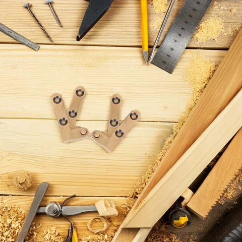 Heavy Duty Hidden Door Pivot Hinges Bronze Finish for Secret Doors on wooden workshop table surrounded by tools