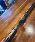 Close-up of Oryx Sportsman Tika T1X SA Right Hand Chassis System Black Rifle Stock on wooden table