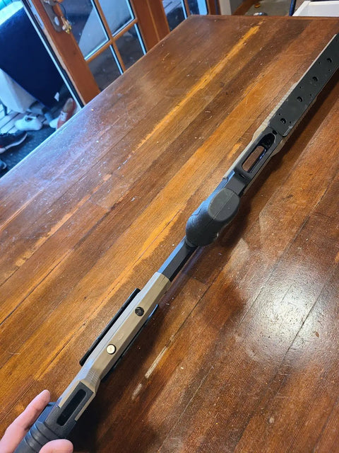 Close-up of Oryx Sportsman Tika T1X SA Right Hand Chassis System Black Rifle Stock on wooden table