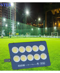Ultra High Output Led Flood Light Heavy Duty Weather Proof Security Beacon Projector Bulb 500W in a sports field at night.