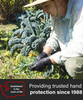 Nitrile disposable gloves, black, X-Large, textured diamond grip, worn by gardener.