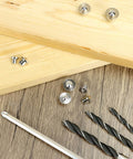 Pro Grade Dowel And Tenon Center Transfer Plugs For Woodworking, 20 Piece Chrome Steel Set on a wooden background with tools