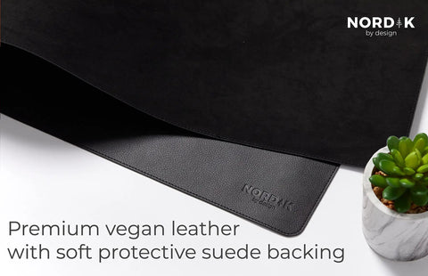 Close-up of Pebble Black Leather Desk Mat With Cable Organizer 35 By 17 Inches, Premium Vegan PU Desk Pad And Mouse Mat, felt surface.