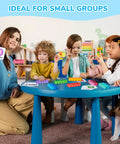 Children using Ten Frame Math Learning Kit With 24 Ten Frames And 20 Task Cards at a small blue table in a classroom setting.
