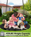 Family enjoying Black Outdoor Saucer Swing With PP Mat For Yard Garden And Park Easy To Install Sturdy Steel Frame Weather Resistant Rope
