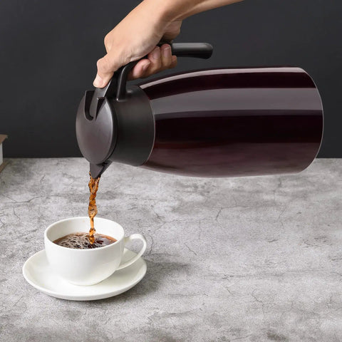 68Oz Ceramic Liner Thermal Carafe With Vacuum Insulation pouring coffee into a cup
