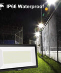 600W LED Flood Light IP66 Waterproof With Plug 6000K Daylight White 60000LM Crazy Bright Outdoor Floodlight illuminating a fence